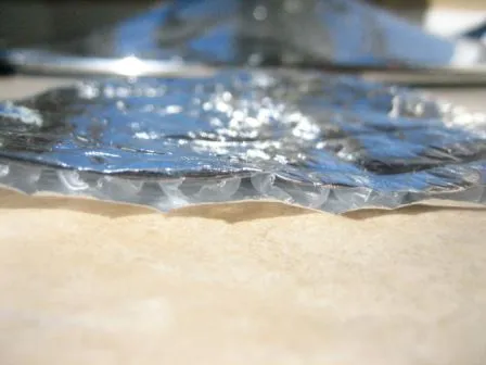 Reflective single bubble insulation showing its foil facing and air bubble core